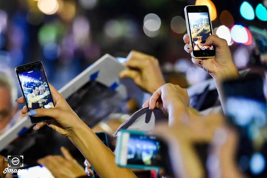 Fans swarmed Johnny Depp with cell phones in hand to take a photo of him.&nbsp;